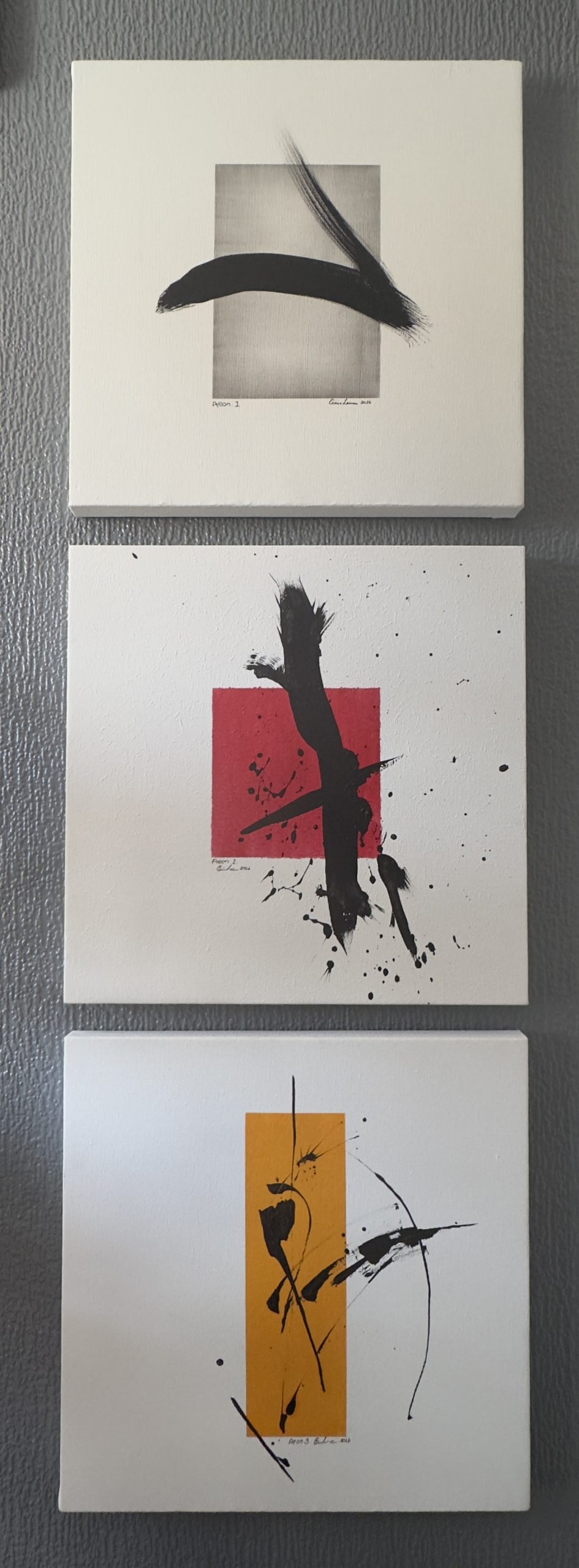 Aeon, a three-panel abstract series by Eiain Lennon progressing from grey to red and ochre with black gestural marks